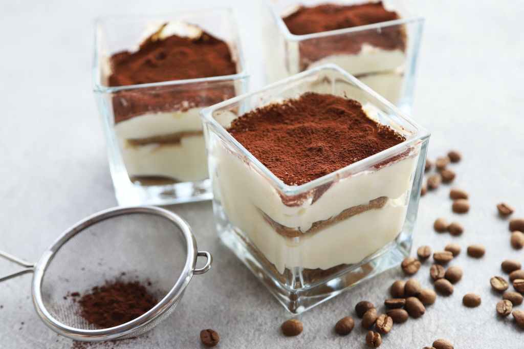 Tiramisu dessert in a glass with coffe